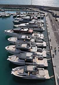 Yachts moored at the pier alongside the Torretta restaurant.