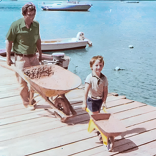 Brian Deher with his father Michel in earlier days of the marina build. Michel and his wife, Kathy, began building Dock Maarten  previously named Great Bay Marina  in 1978 and expanded it six years later.
