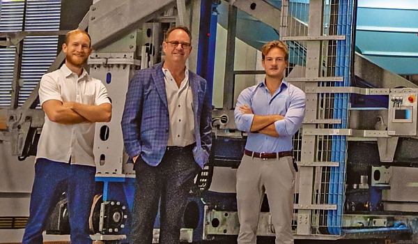 ASAR founder and CEO Robert Brown (centre) with his sons Max Brown (left), vice president, and David Brown (right), business development, inside the Gulf Star Marina drystack building.