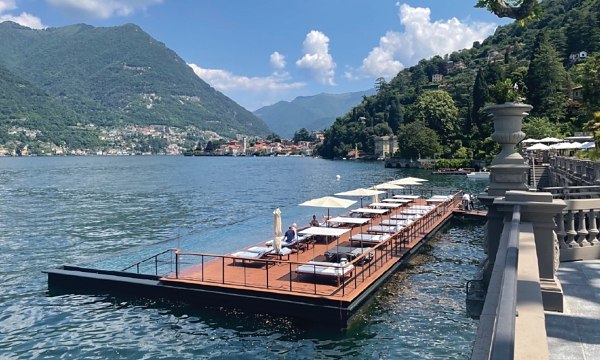 An infinity pool and sundeck, designed and built by Bluet for the Mandarin Oriental Lago di Como hotel in Italy, blends seamlessly with the lake.