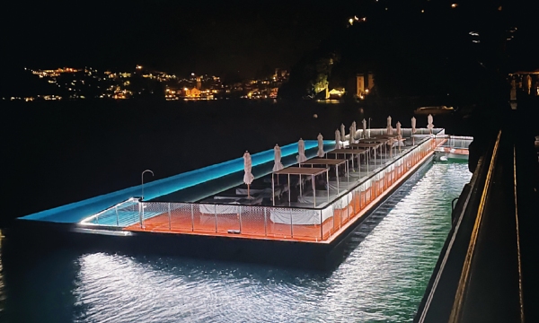 The infinity pool and sundeck at night fall.