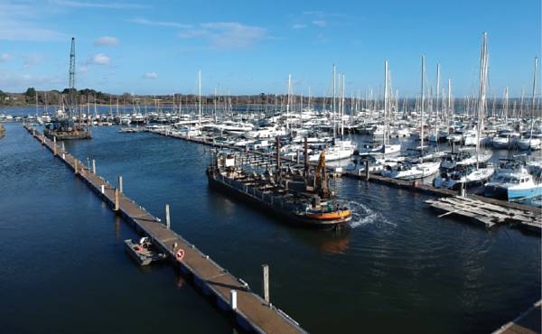 Dredging barges in Lymington Yacht Haven on their way to help protect the nearby salt marshes.